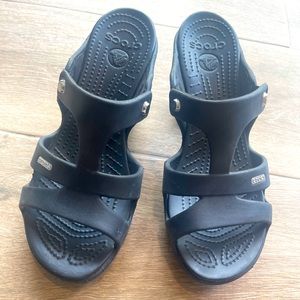 Black pair of women’s croc wedge heels size 9W